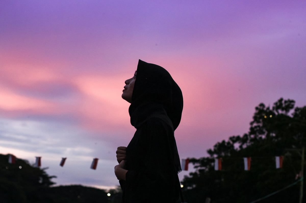 Women in hijab enjoying a sunny day at a city park